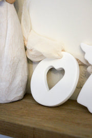 Medaillon fabrication artisanale coeur en argile