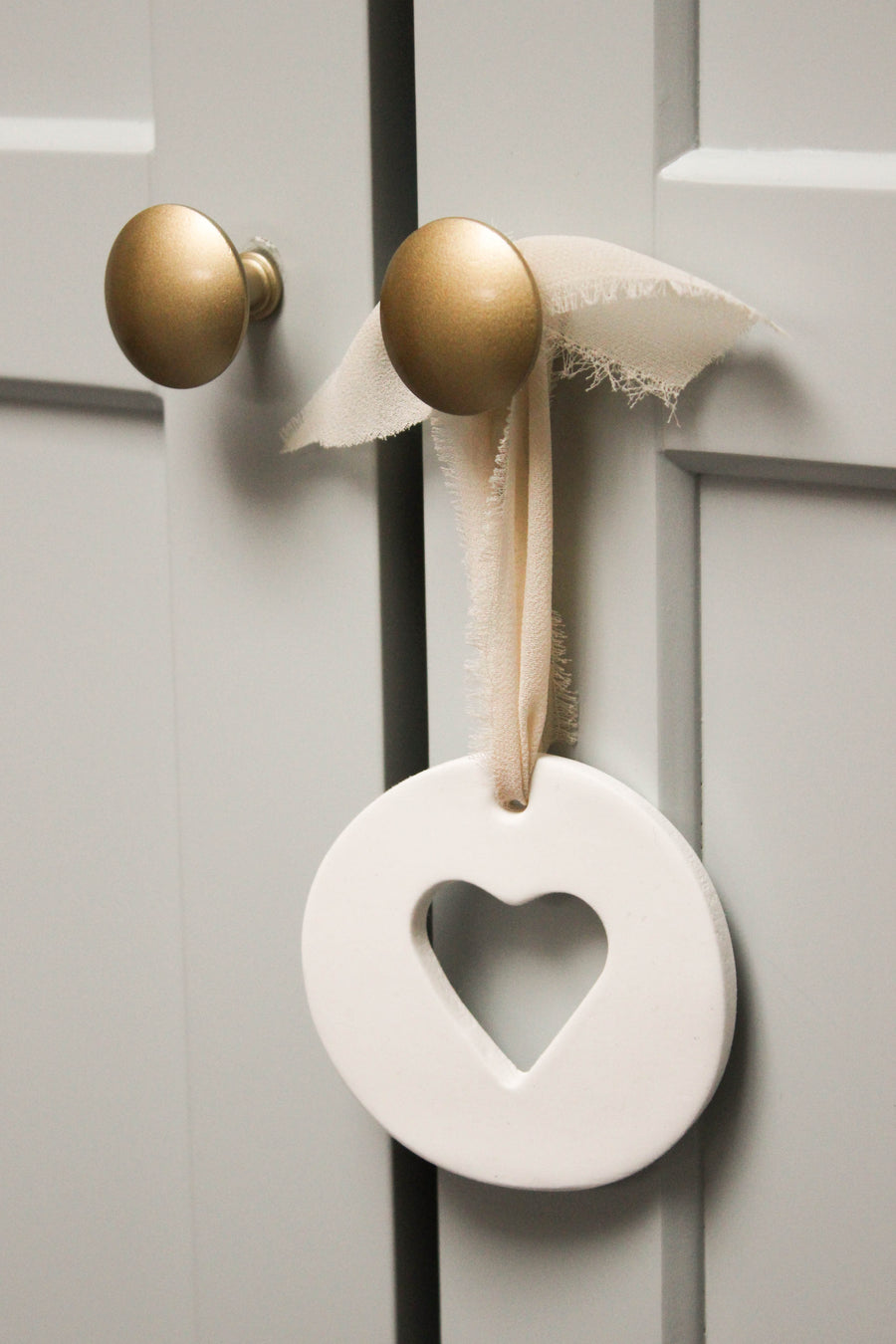 Suspension argile medaillon coeur